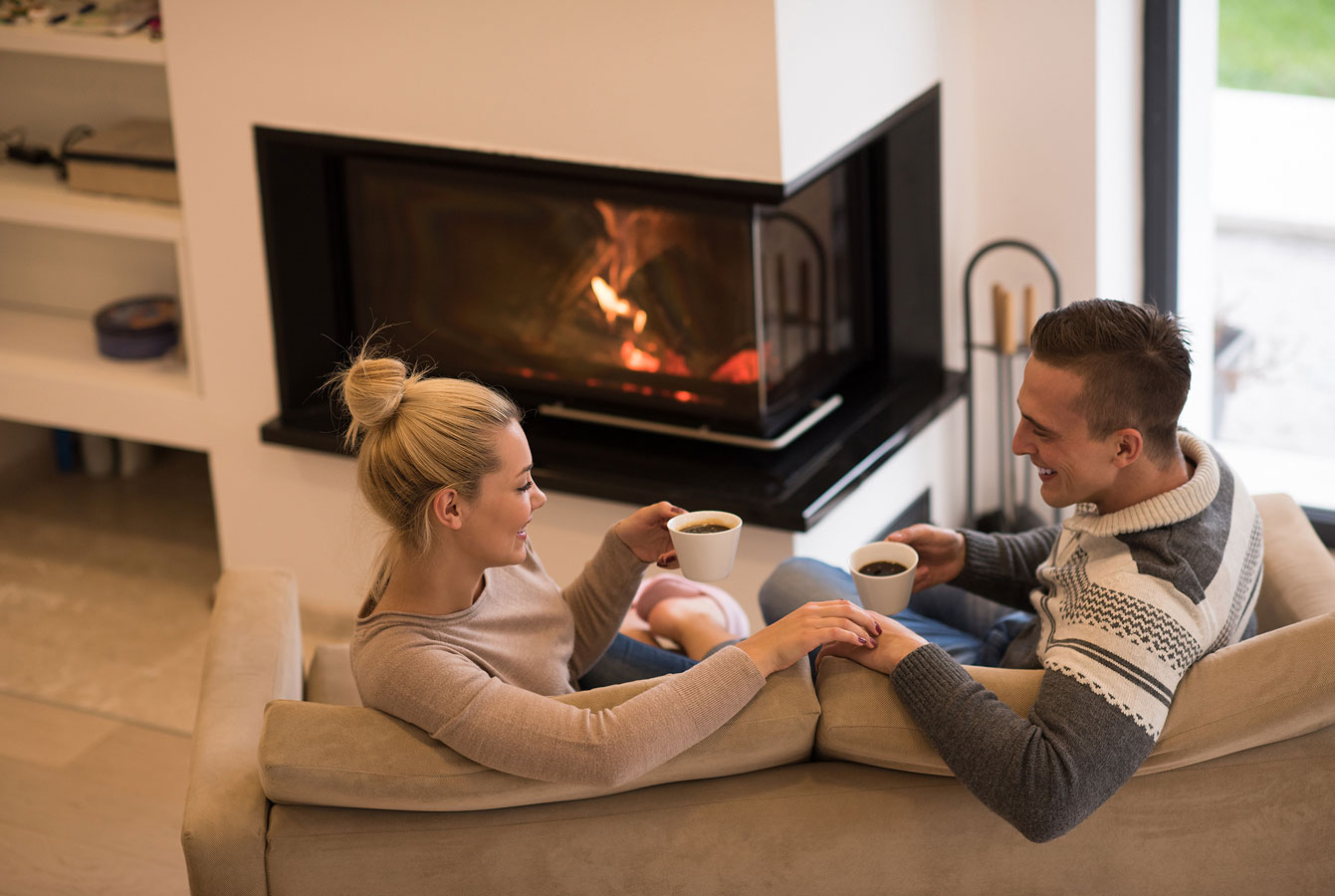 couple-by-fireplace-in-living-room